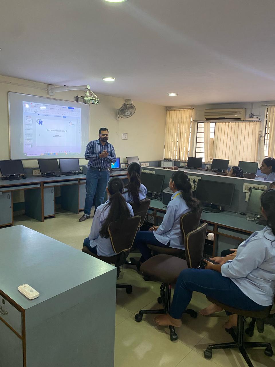 Deven Dande with students during an academic session